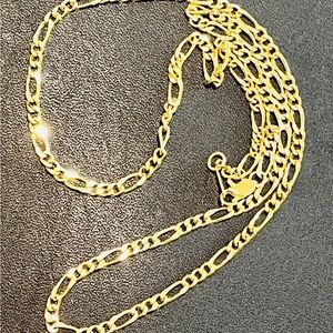 Figaro chain necklace gold tone. Approximately 19 inches.
